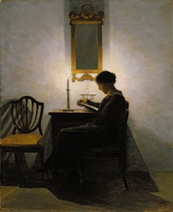Woman-reading-by-candlelight